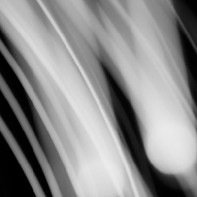 Abstract motion blur of a person in a dynamic yoga flow.
